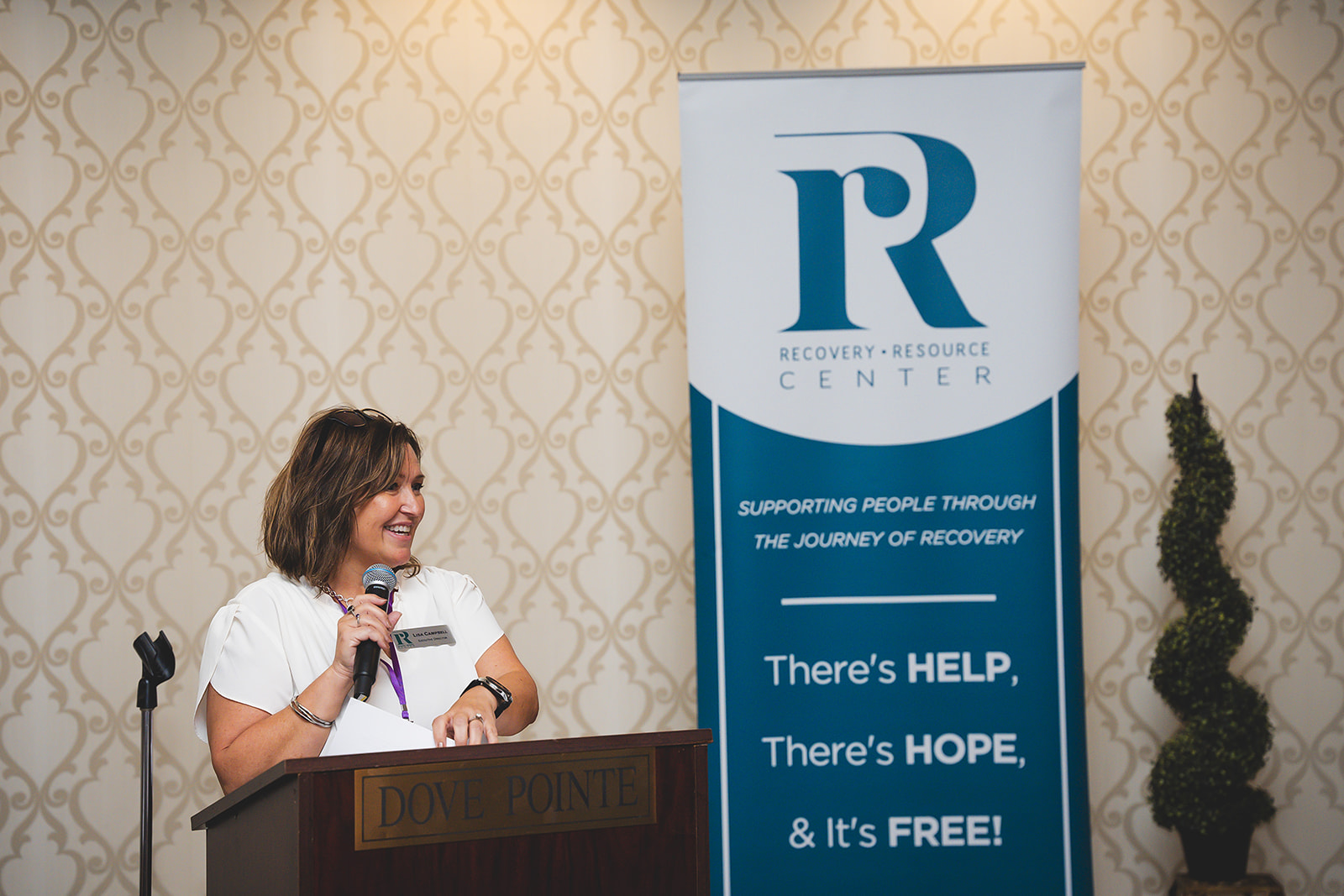 A picture of the Executive Director of the RRC speaking at the annual breakfast fundraiser.